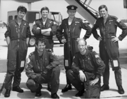 Flight Lieutenant Simon Farlow and his crew (standing), immediately before the flight